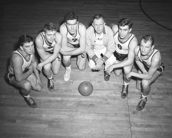 Basketball Players Kneeling with Coach