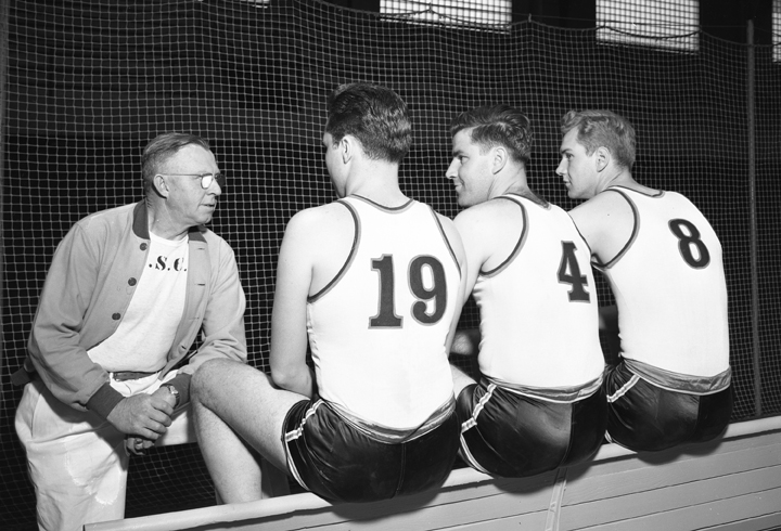Coach talking with Basketball Players