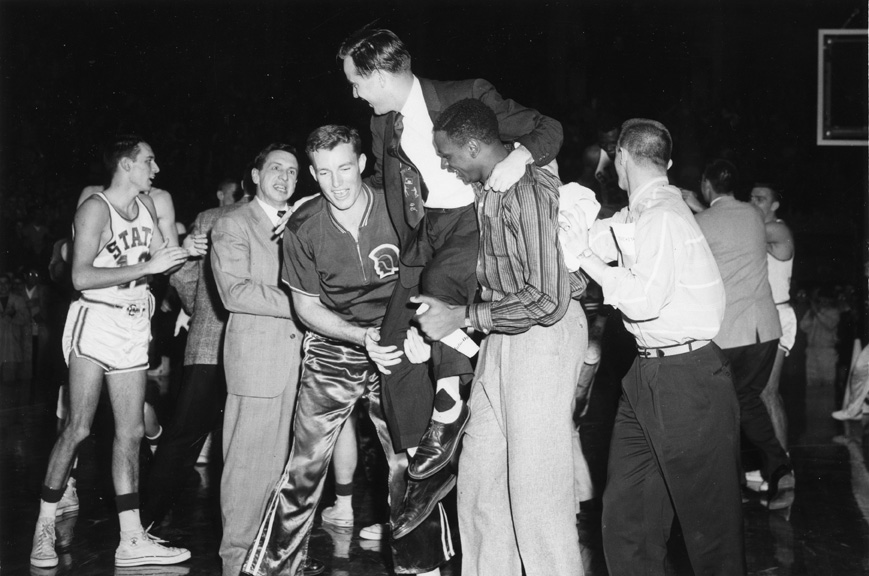 Players Hoist Coach on Shoulders in Midst of a Crowd, 1957