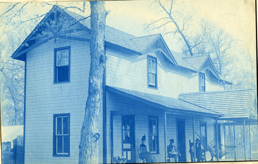 19. People on the porch of a house or cottage, circa 1888.