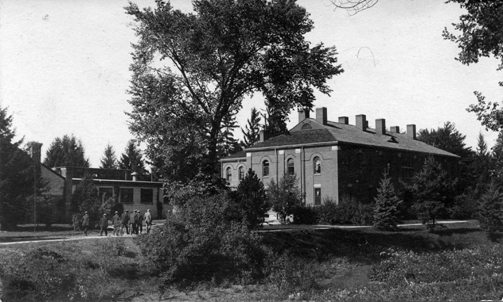 A group of people walking toward Abbot Hall