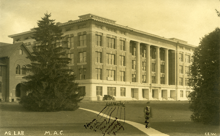 A group of people sitting in front of Agriculture Hall