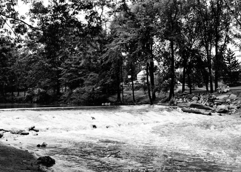 Workers Resting on the Banks of the Red Cedar River, circa 1947