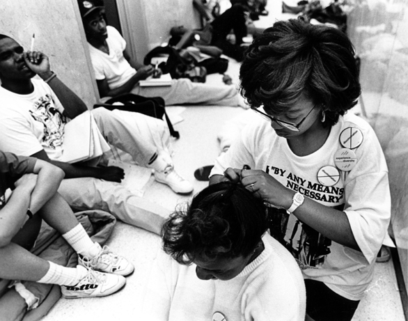 Female student styles hair of another student during the 1989 Hannah Building occupation