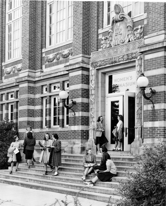Women sitting on the steps of the Women's Gymnasium