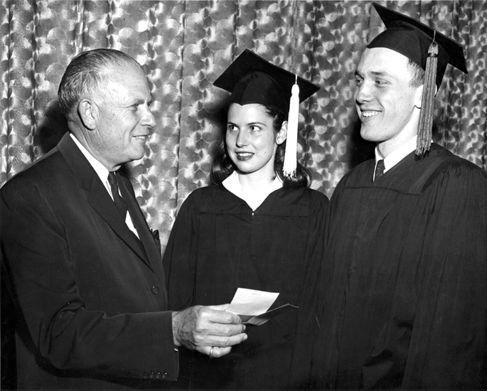 President Hannah presents scholarships to students