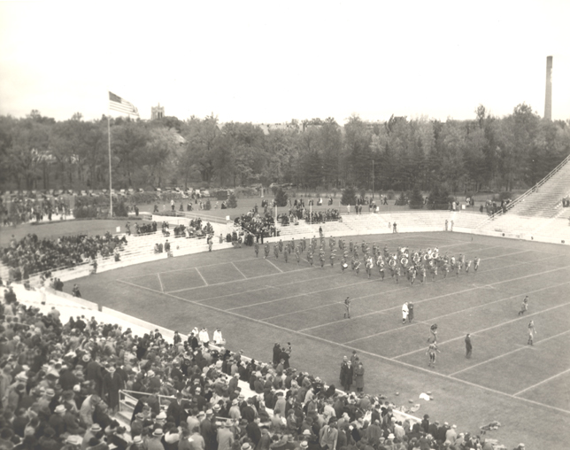 The marching band performs at the football stadium