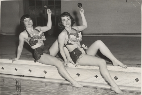 Two swimmers pose in costume