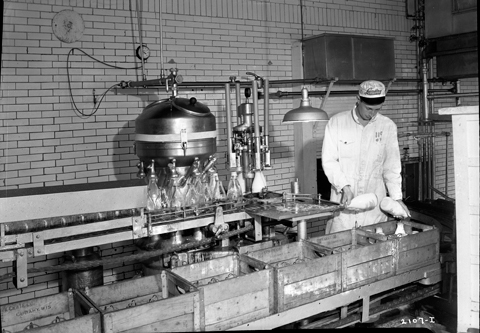 Dairy Worker with Bottled Milk
