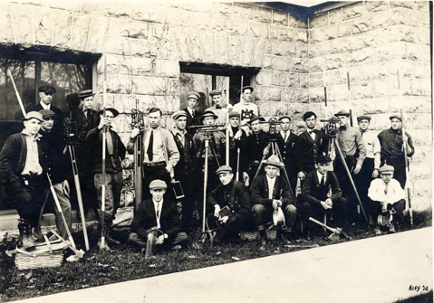A groups of students with surveying equipment, 1913