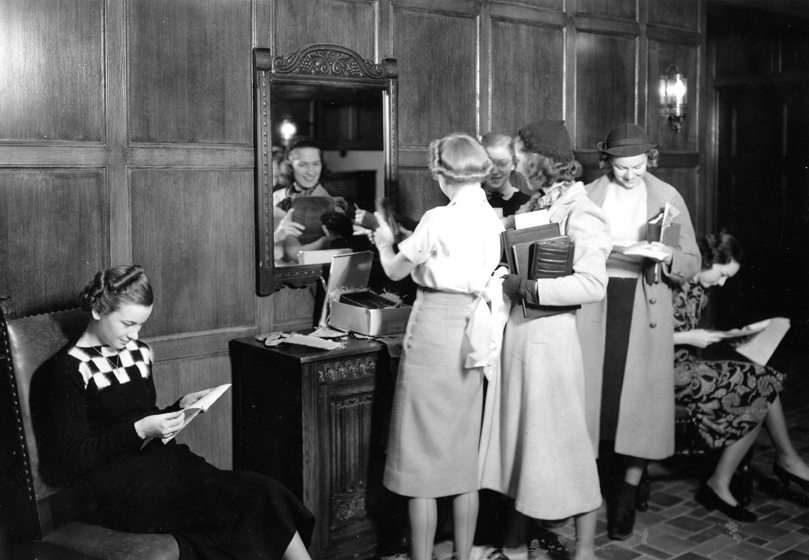 Women receive packages at their dorm, Undated