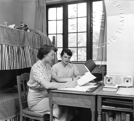 Two women study in their dorm room, 1955
