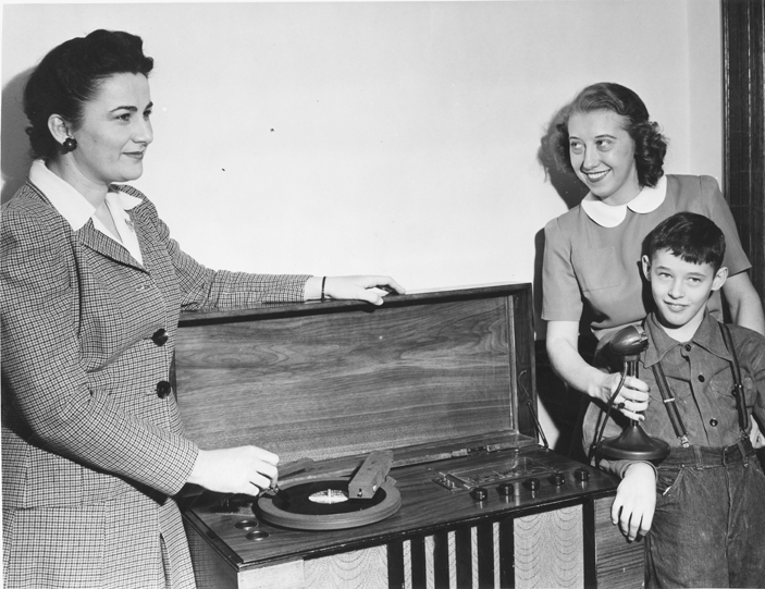 Child recording on a record, date unknown