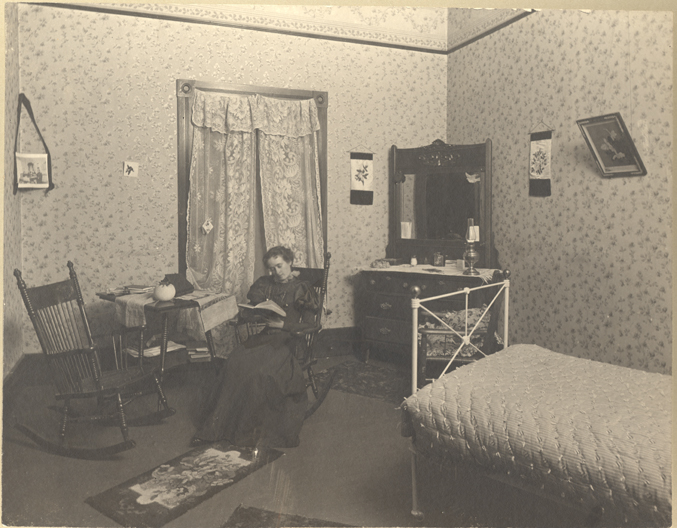 Female student studying in Abbot Hall, circa late 1890s