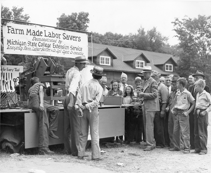 Farmers look at new tools, date unknown