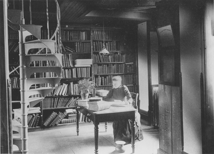 Miss Landon in Linton Hall library, date unknown