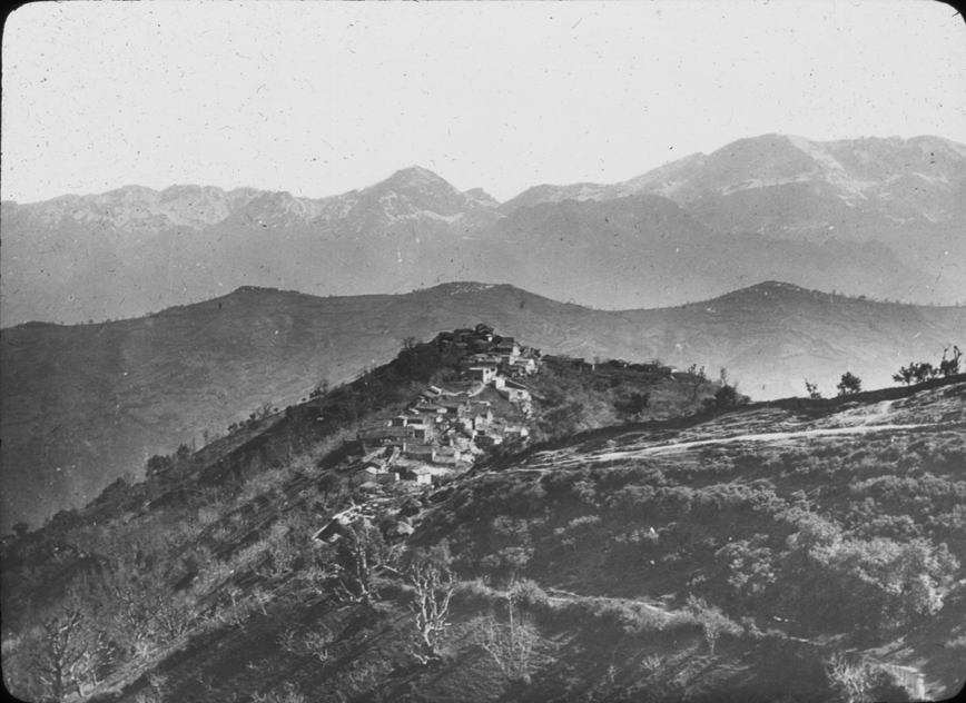 Mountain scene in Algeria with ridgetop town, undated