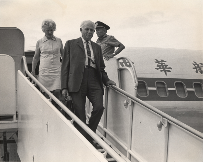 The Hannahs disembark a plane, date unknown