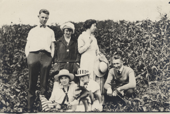 Five students pose, date unknown