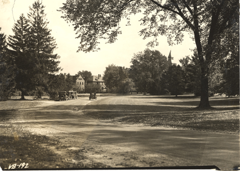 Cars driving towards campus, 1923