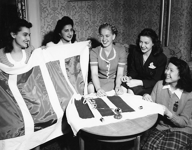 Students sew with the International Club, date unknown
