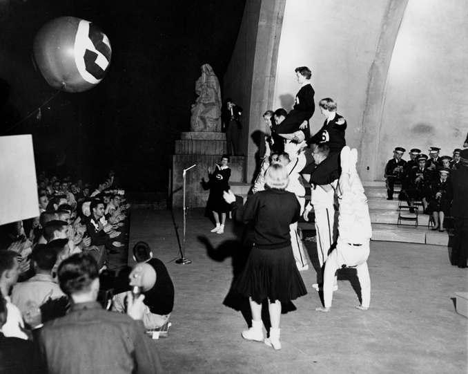 Cheerleaders at pep rally on the Band Shell, 1957
