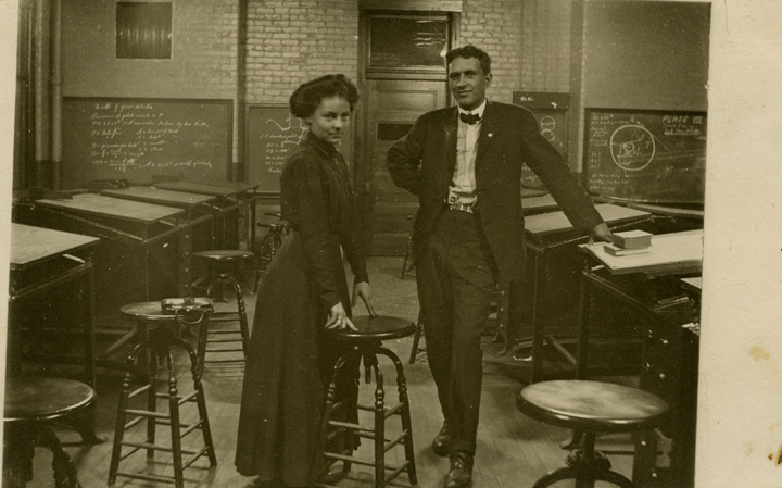 A man and woman in a classroom, date unknown