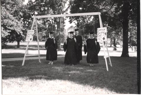 Students on Swings with "Senior Swing Out" Signs, date unknown