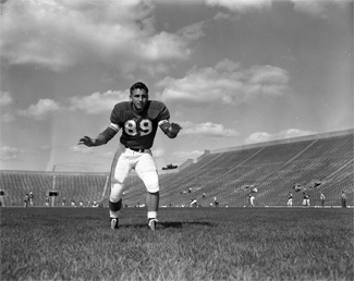 Press Day, Donald Kauth on football field, 1954