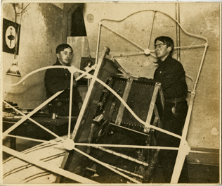 Two Men Stacking a Dorm Room