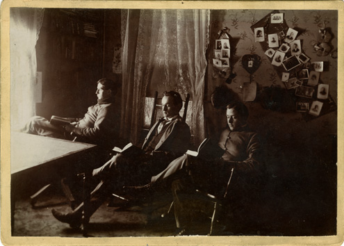 Three Male Students Reading in a Dorm Room