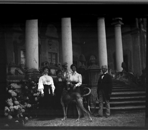A Family in Front of House , date unknown