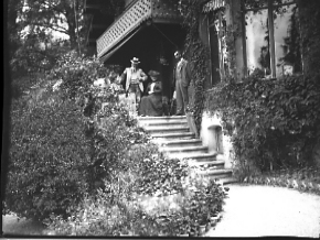 Group of people on porch, date unknown