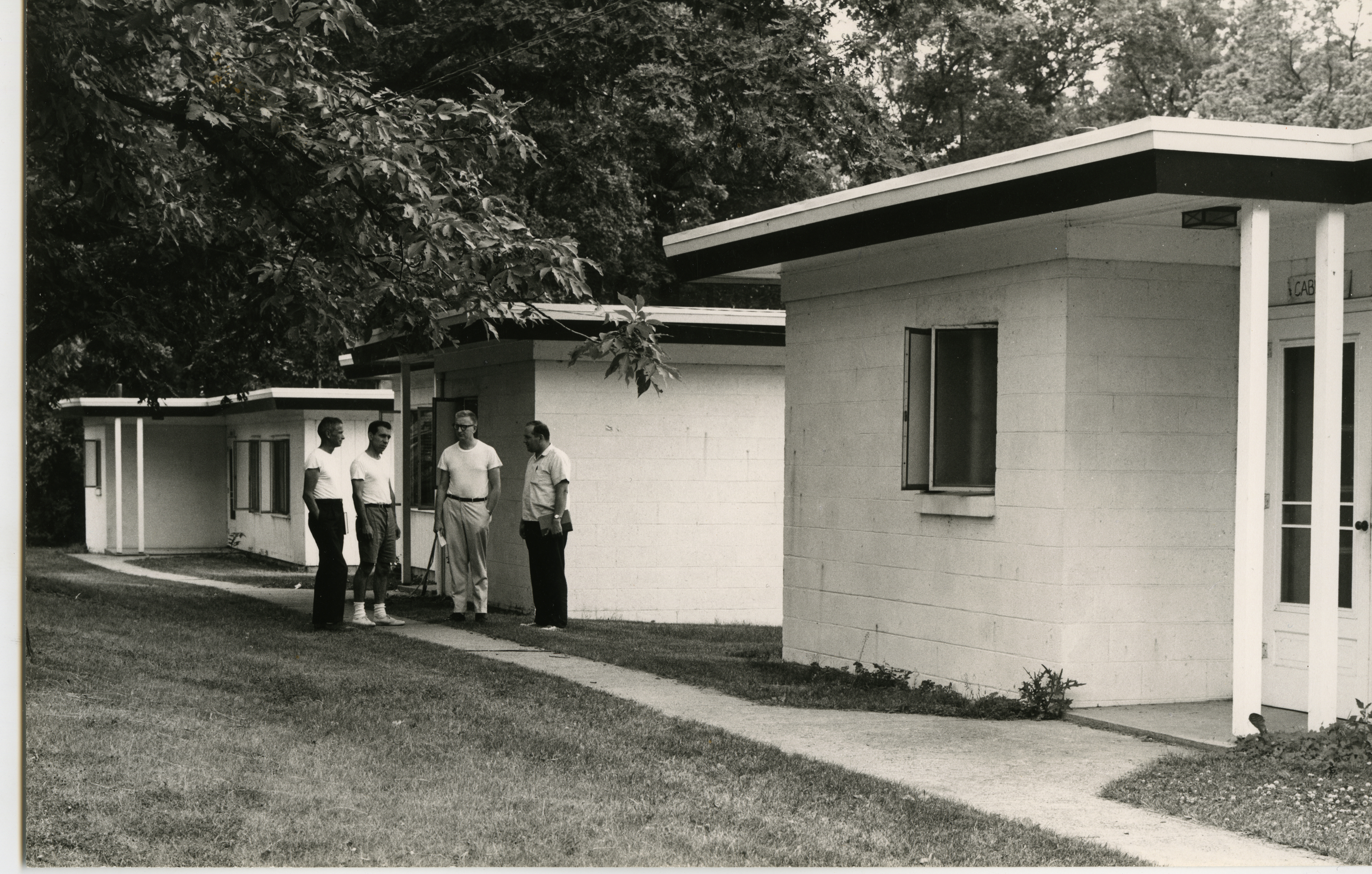 Men standing outside buildings at KBS, 1973