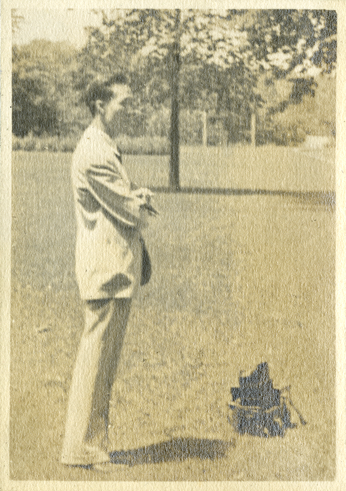 Onn Mann Liang taking an outdoors photograph, 1930