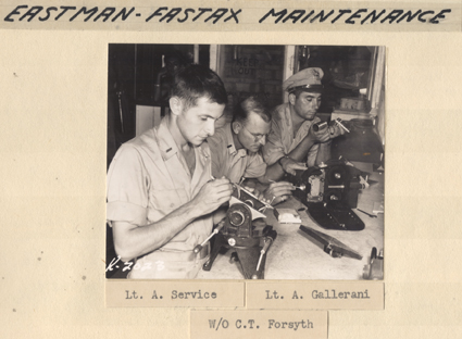 Men perform camera maintenance on Eastman Fastex cameras, 1945-1946
