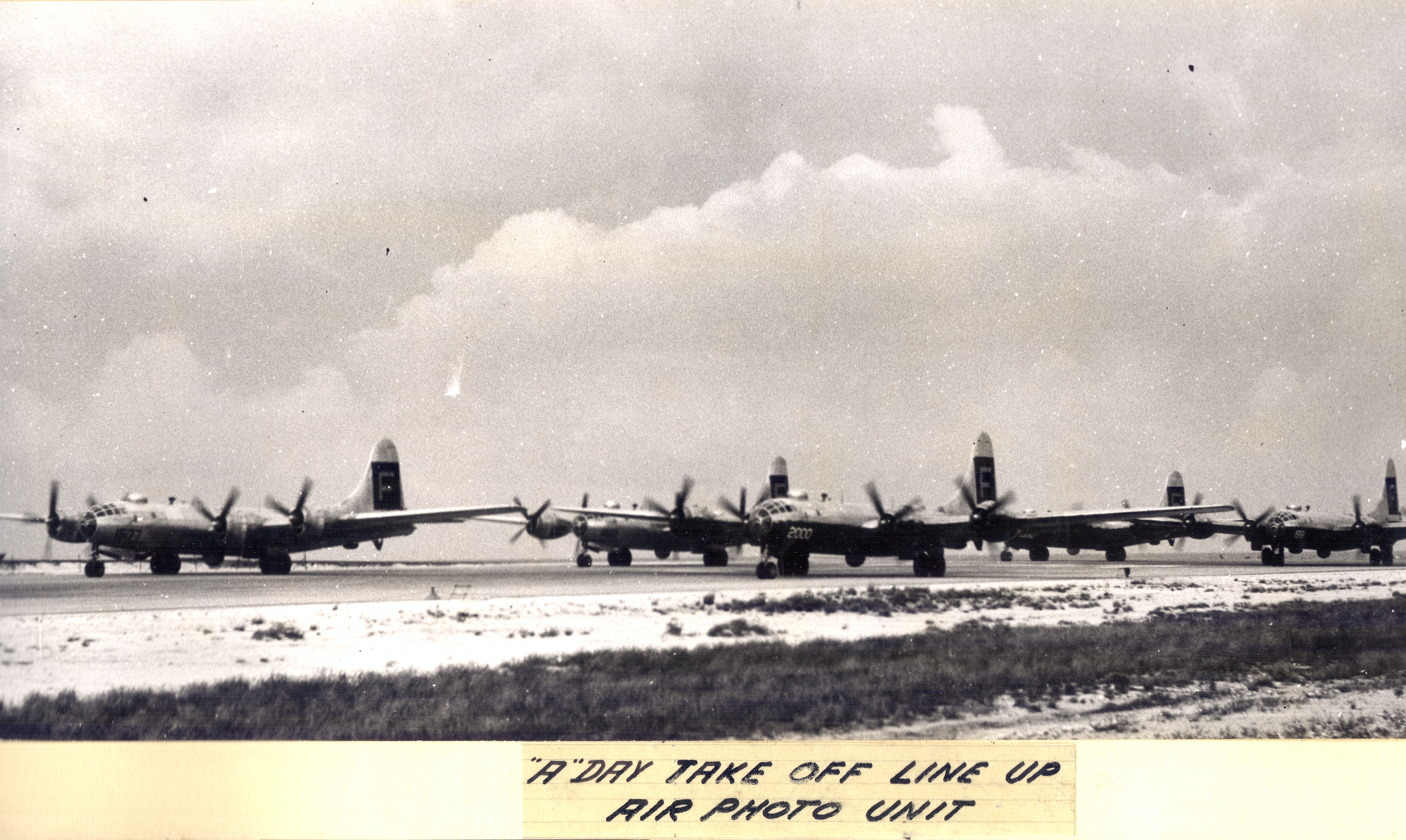 Planes line up to record the first atomic test at Bikini Atoll, 1945-1946