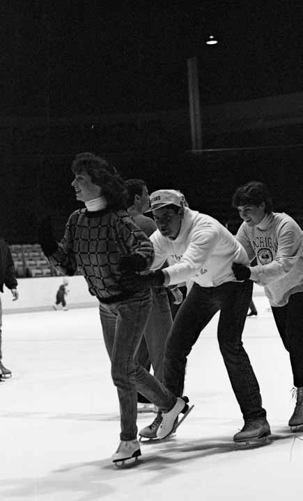 3 Students Skating at Munn Arena