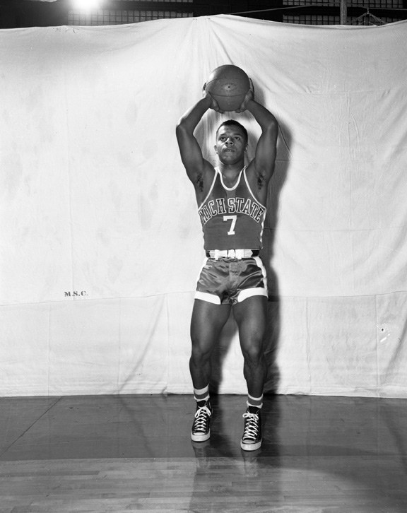Posed Action Shot of basketball player, Reginald Ayala, 1952