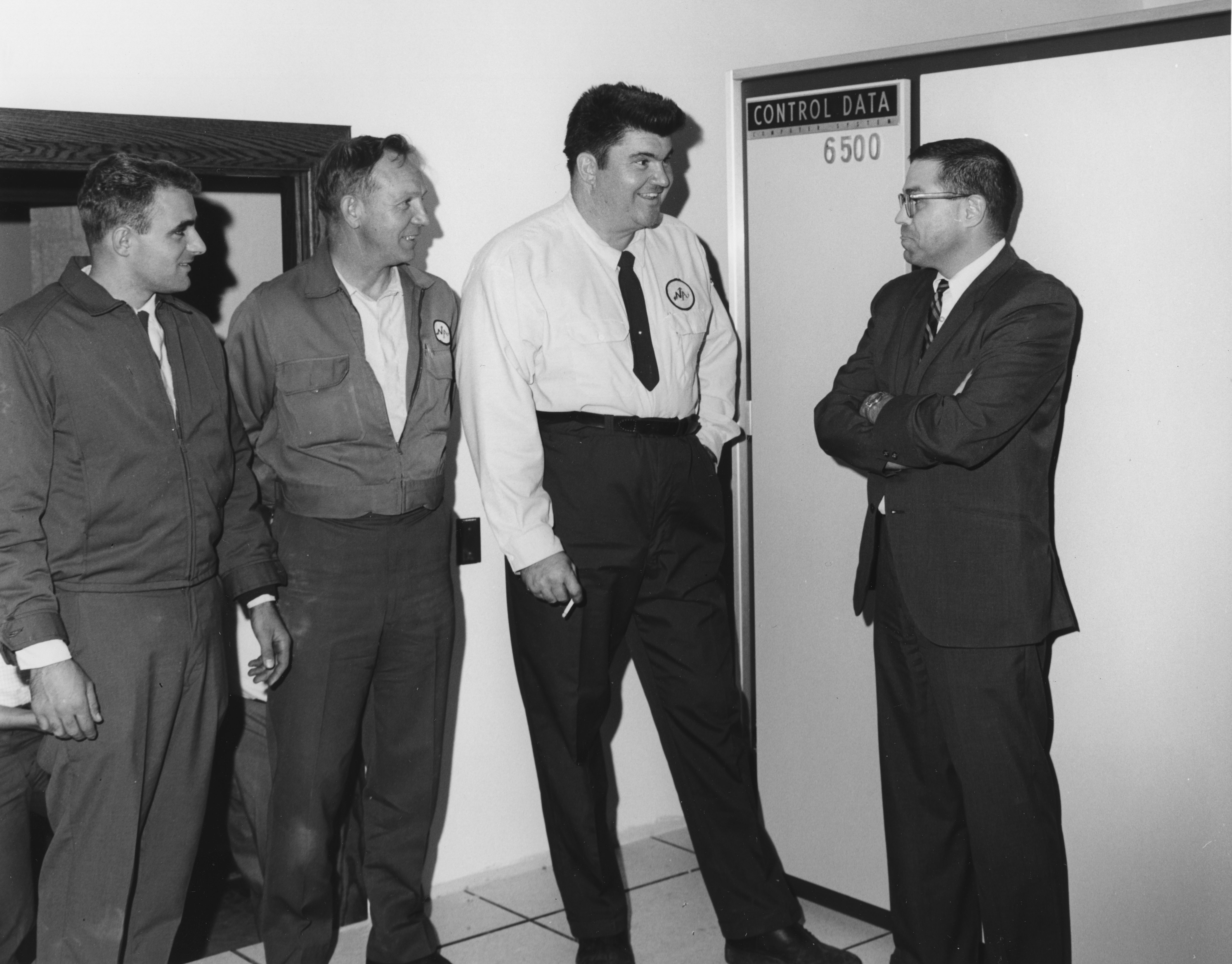 Dr. Kately chats with North American Van Lines drivers, date unknown