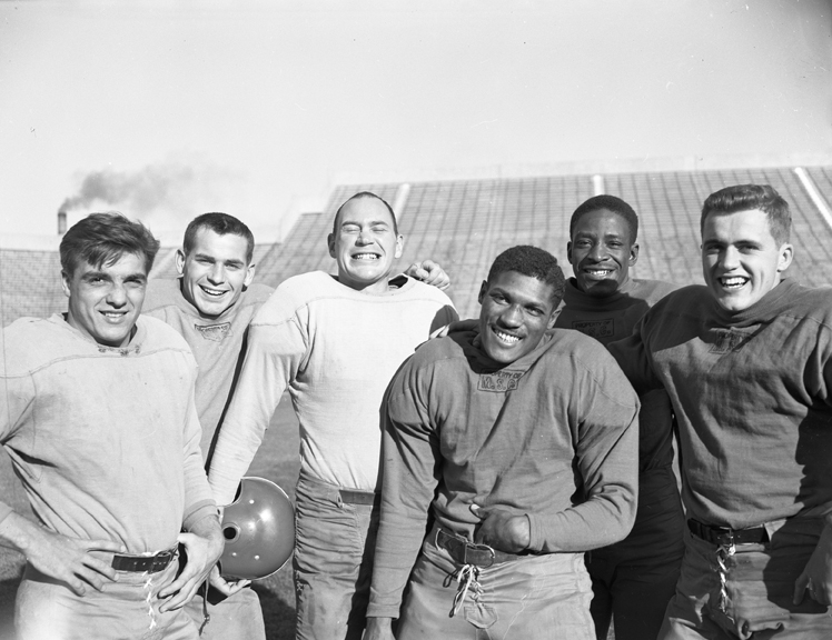 Six Football Players at Practice