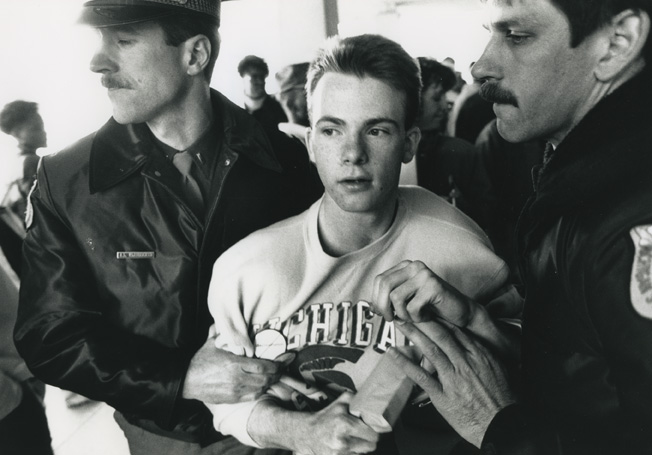 Student led away by police during the 1989 student occupation of the Hannah Building