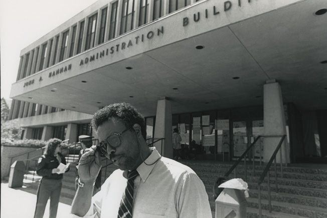 Man walks away from the Hannah Building during the 1989 student occupation