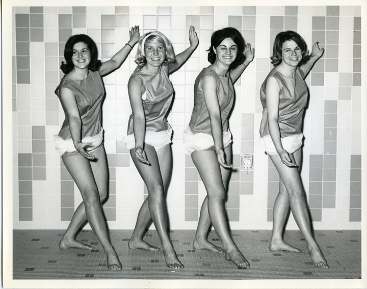 Four women in swimsuits posing