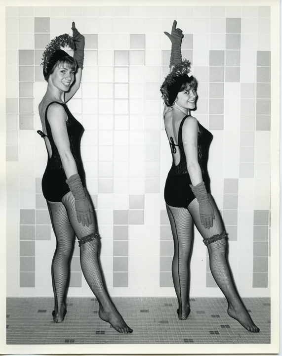 Two women in cabaret outfits