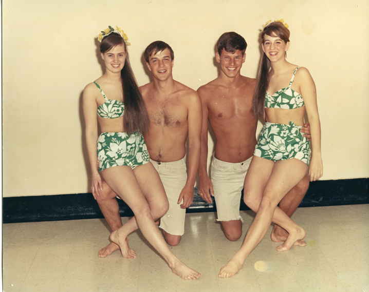 Two female and two male team members posing