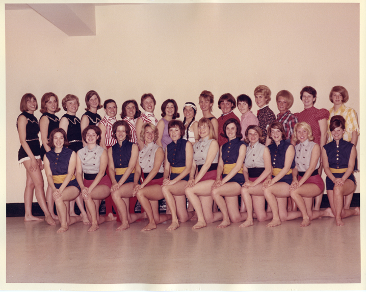 28 Members in costume posing for a group photo